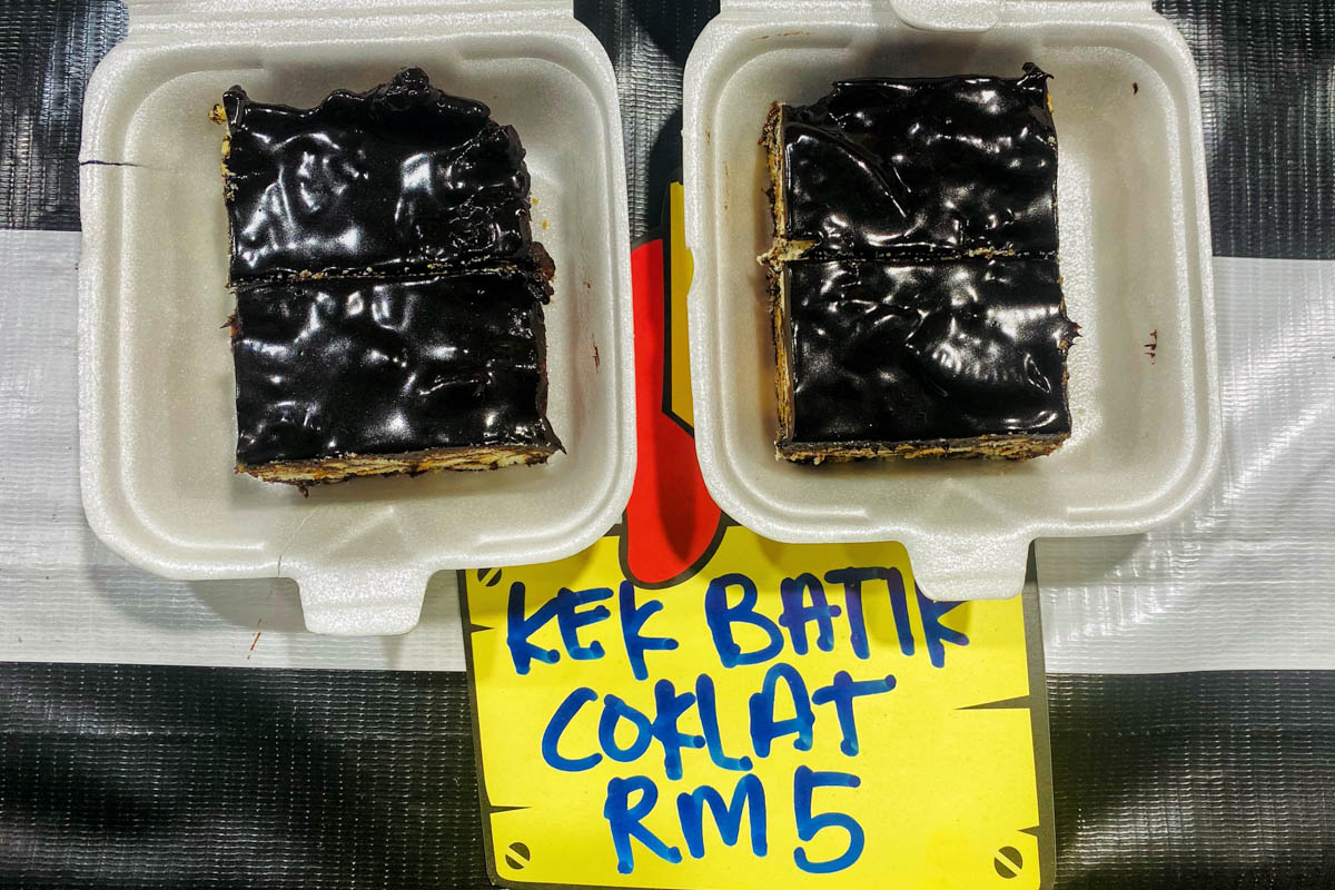 Kek Batik Coklat is known for its rich, chocolatey layers and no-bake preparation