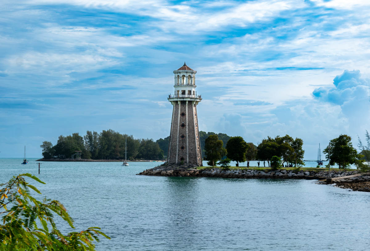 Pantai Kok lighthouse, opposite Paradise 101, provides a scenic backdrop to the clear blue sky and serene beach