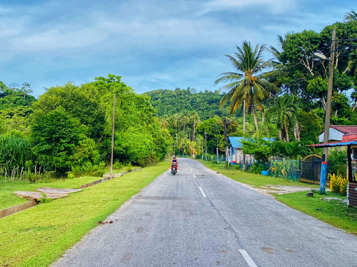 The best way to explore Pulau Tuba's landscape is on a scooter