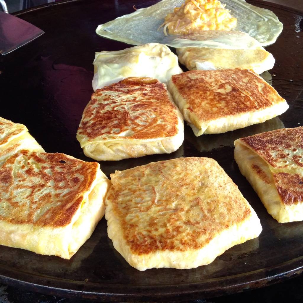 Murtabak is a stuffed pancake that originated in Yemen, was influenced by Indians living there, and eventually became a staple in Malaysia