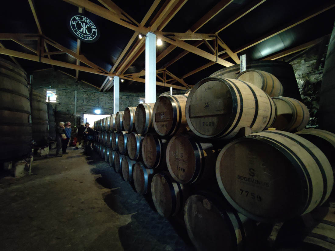 Numerous Wine barrels stacked in the basement where we learned about the stages of wine making
