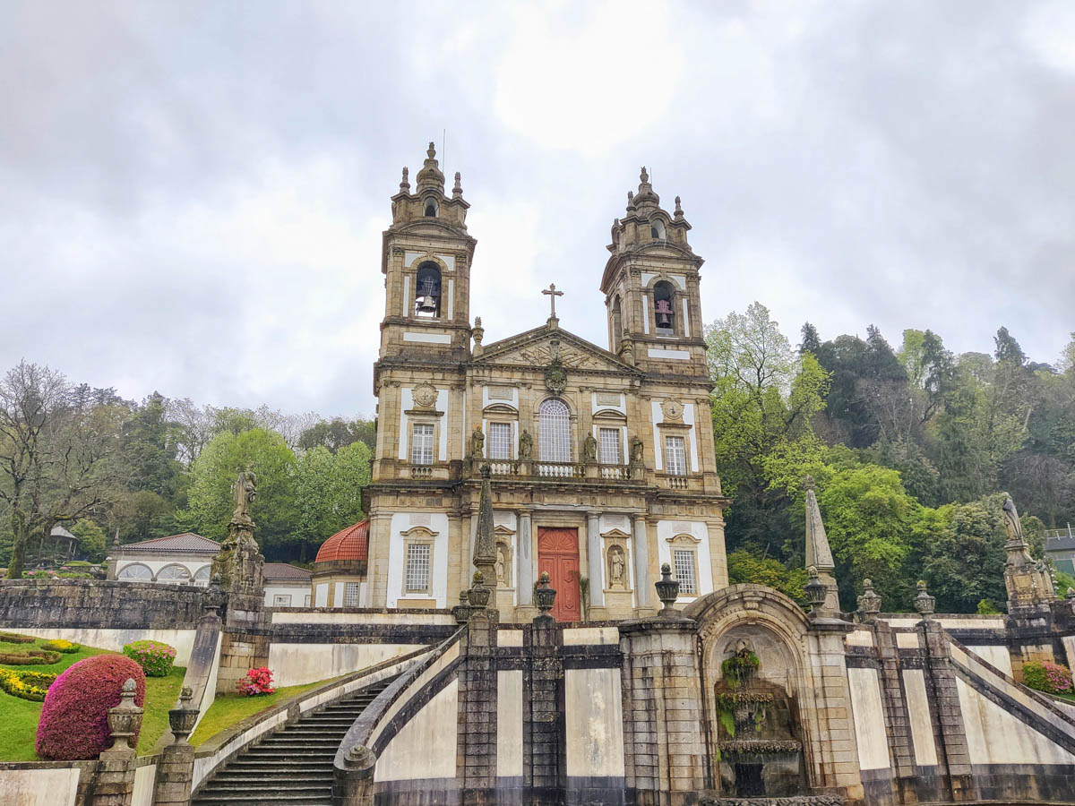 The rain soaked façade of the famous Bom Jesus Church, with the overcast skies in the backdrop