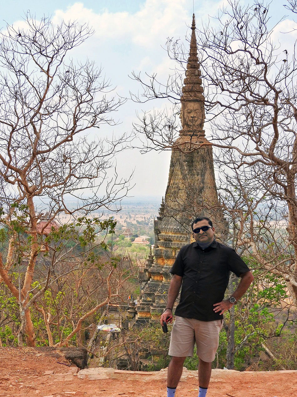 Rahuldev Rajguru at Oudong Mountain with Mukh Proum in the background.