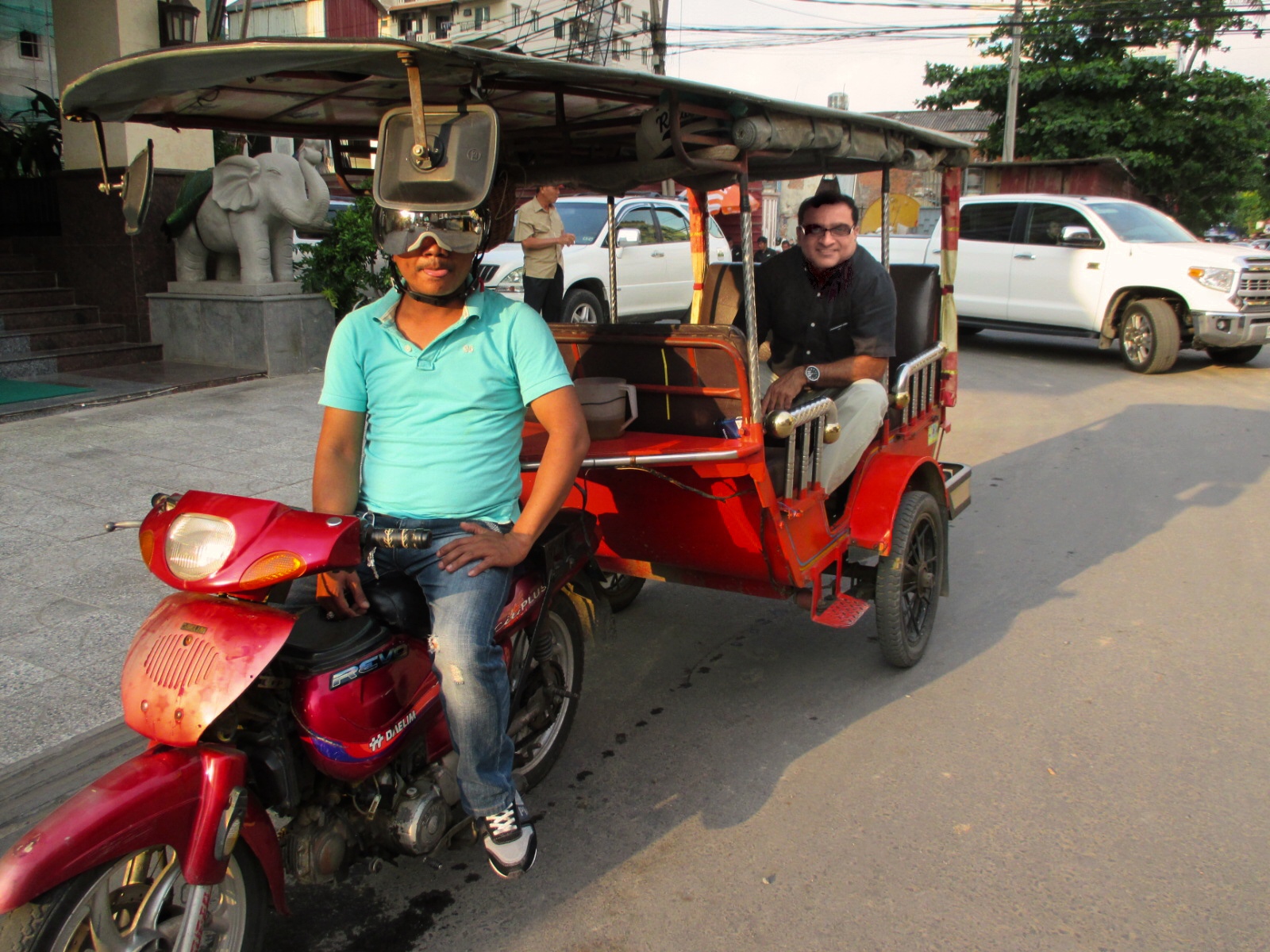 Rahuldev Rajguru riding in a tuk-tuk in Phnom Penh, Cambodia