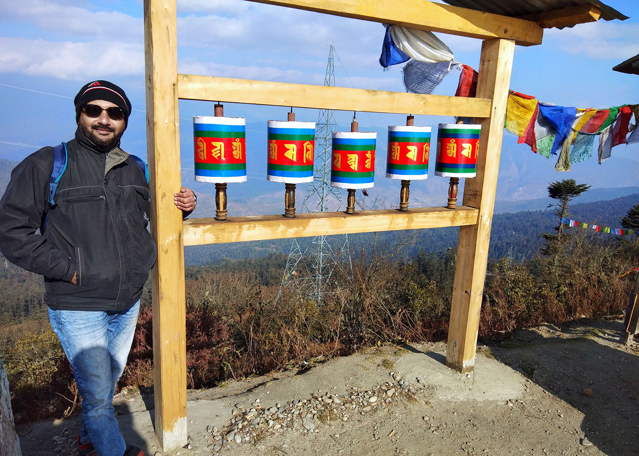Spinning the prayer wheels as per Buddhist tradition at Chele La pass