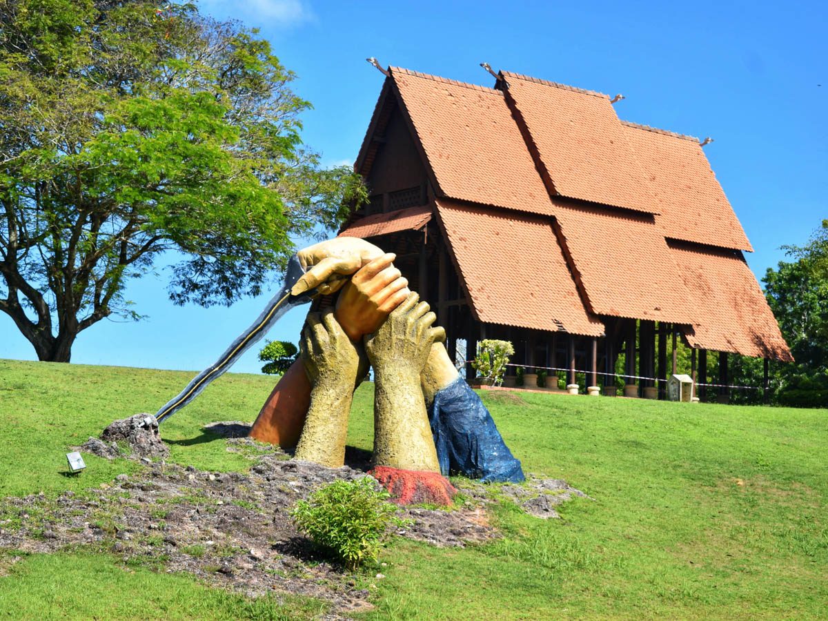 Beautiful represention by the sculpture of clasped giant hands