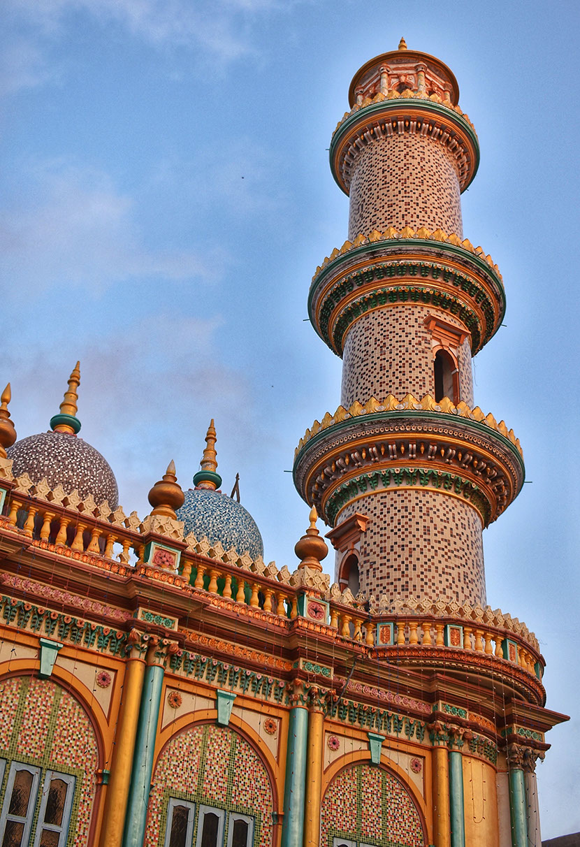 The vibrantly colored minarets with intricate carvings of Jumma masjid (mosque)