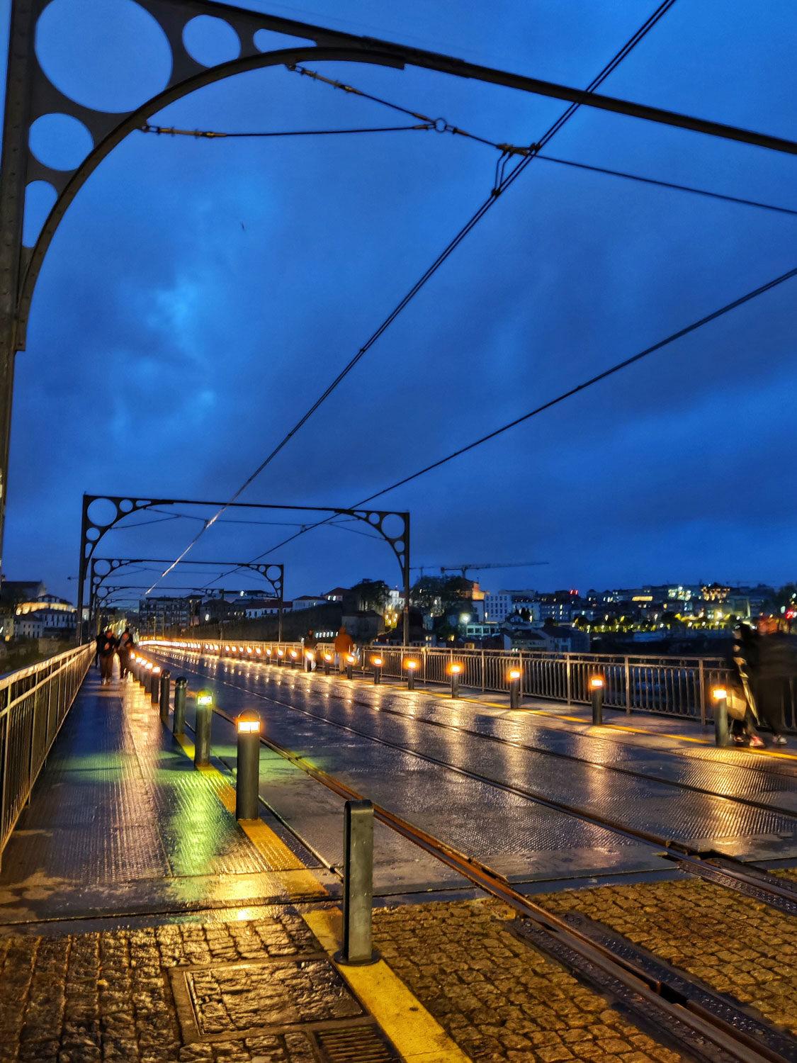 The illuminated upper deck of Luis Bridge in Porto