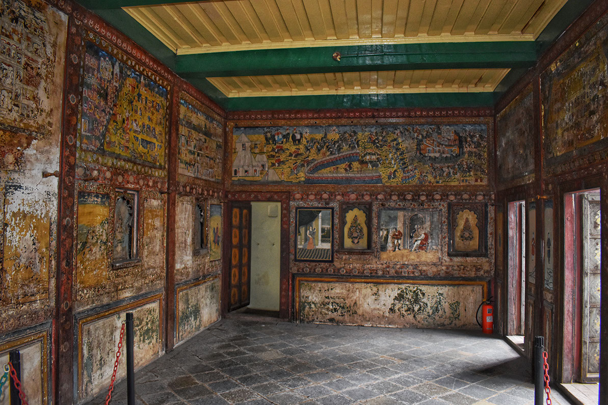Paintings from different schools of art decorate the first floor hall for Tambekar Wada