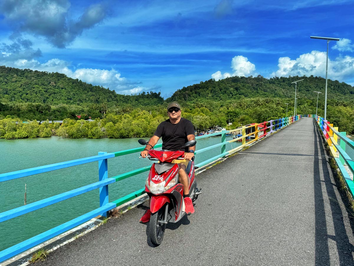 This is me on a scooter exploring the island of Pulau Tuba