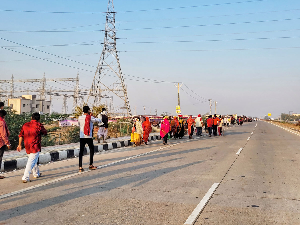 Fuldol festival devotees walking on the highway to Dwarka