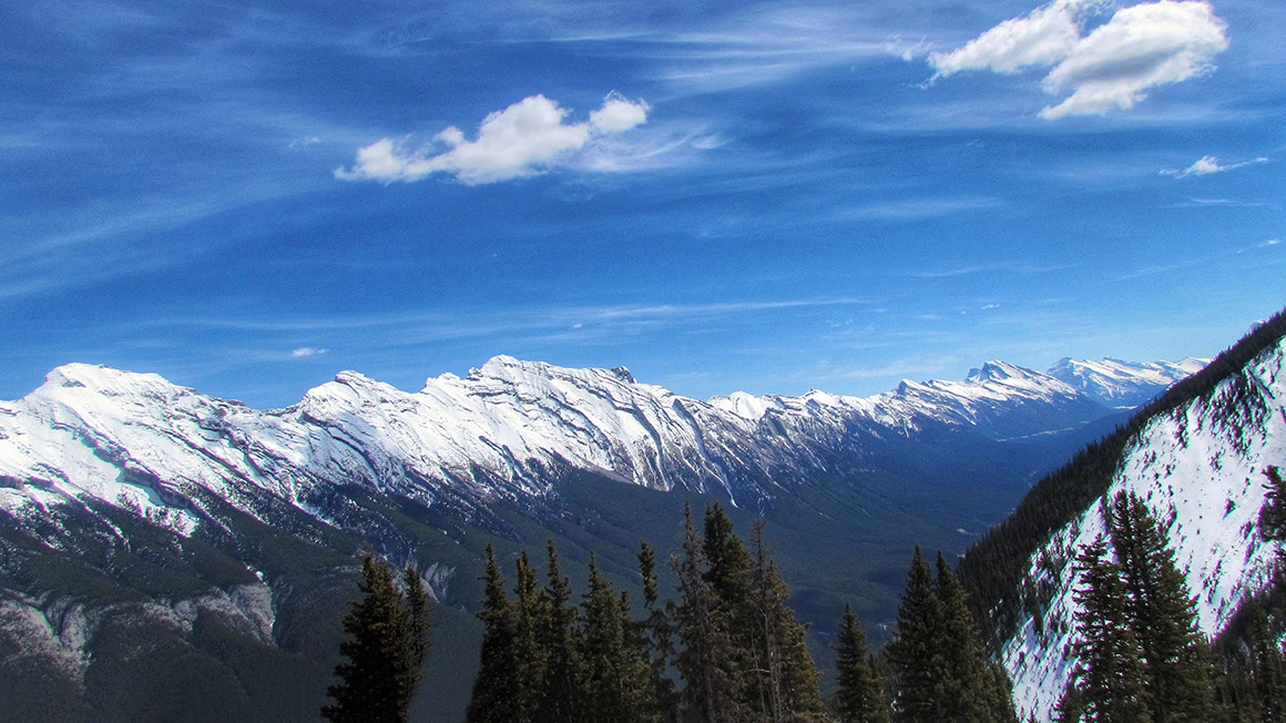 A striking view of the majestic snow-covered peaks from Sulphur Mountains