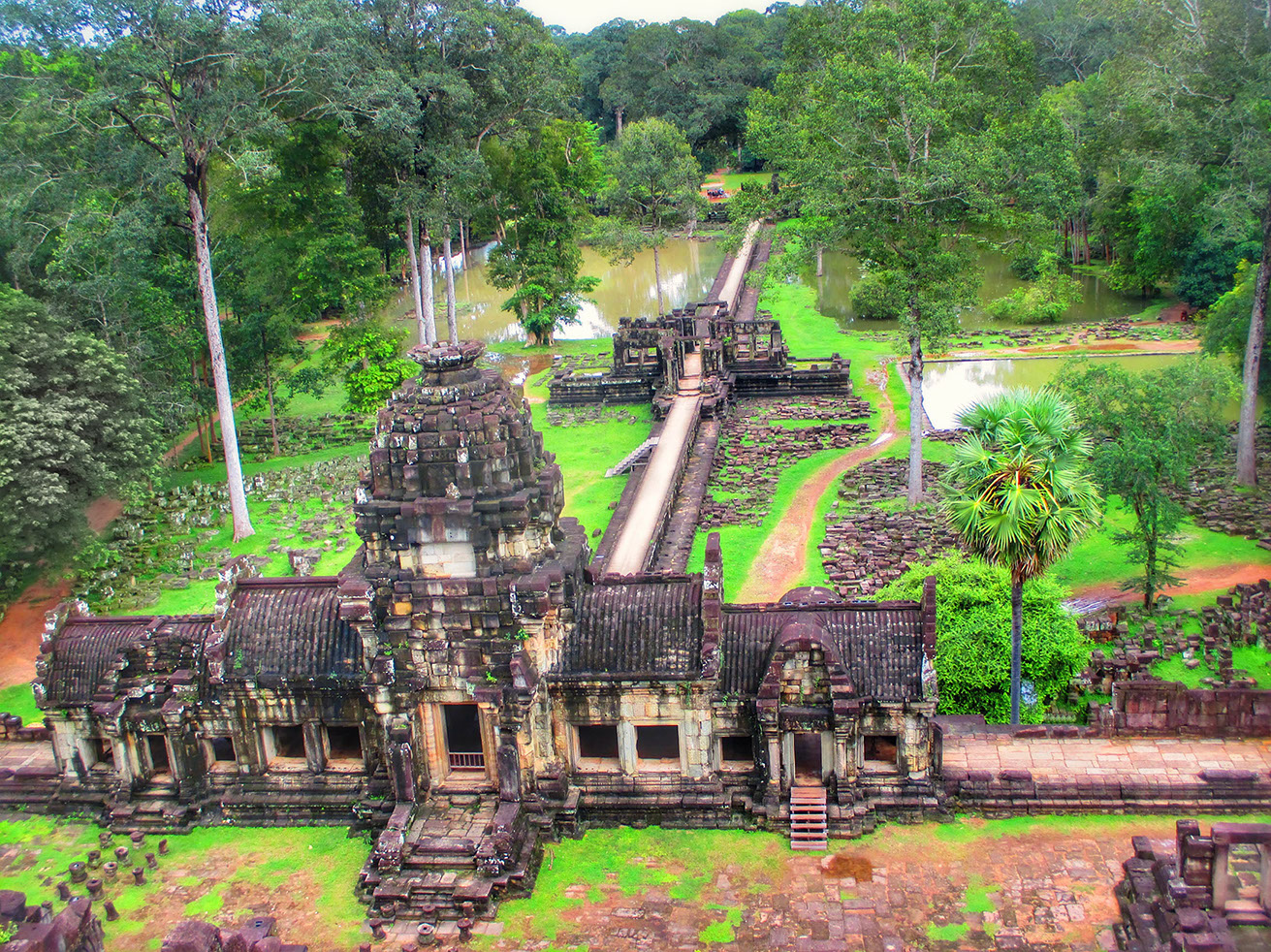 Panoramic view of the long pathway to Baphoun temple surrounded by a moat