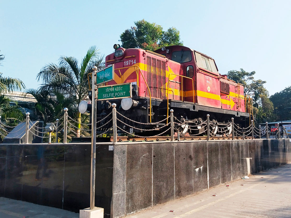 The selfie point at Vapi Railway Station features an old diesel locomotive monument