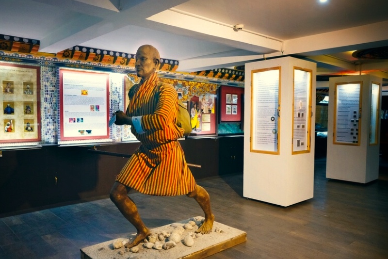 Bhutan postal runner statue with its traditional attire at the postal museum in Thimphu