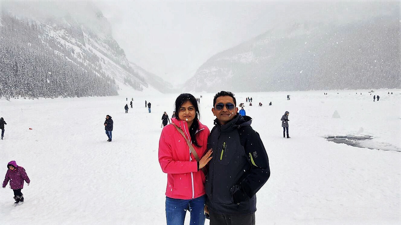 A couple at Lake Louise enjoying the winter wonderland