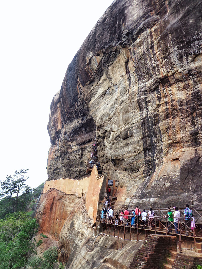 Climbing stone steps up the Sigiriya rock