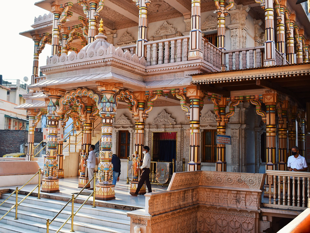 Colorful pillars with intricate carvings at Swaminarayan Temple Kalupur