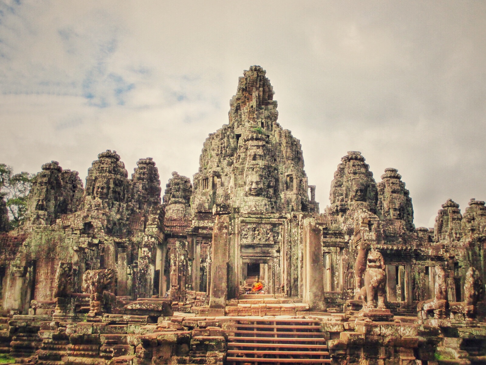 The Bayon Temple with the enormous smiling face stone towers in Angkor Wat complex