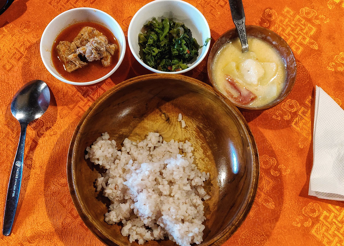 Authentic Bhutanese food: Maru, Kewa Datshi, Lom and Red rice