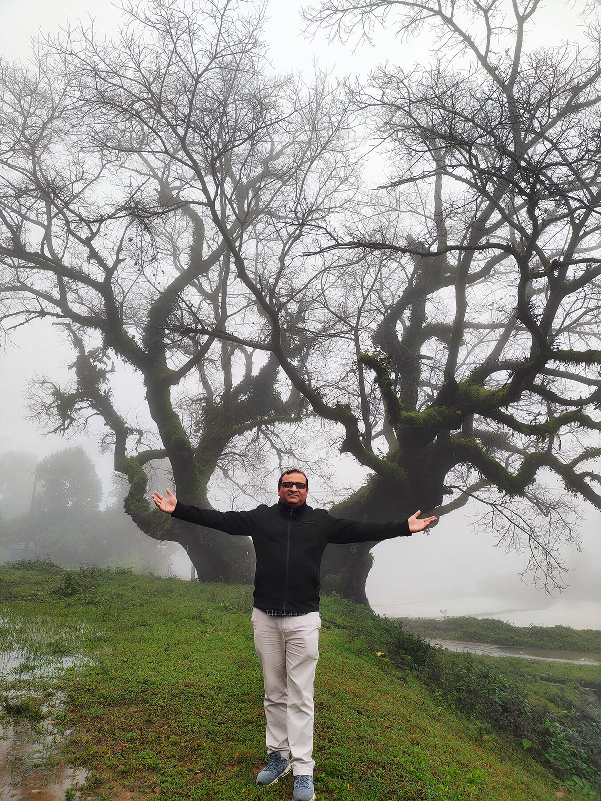 Rahuldev Rajguru is trying to emerge with the surroundings on a misty morning in Coorg.