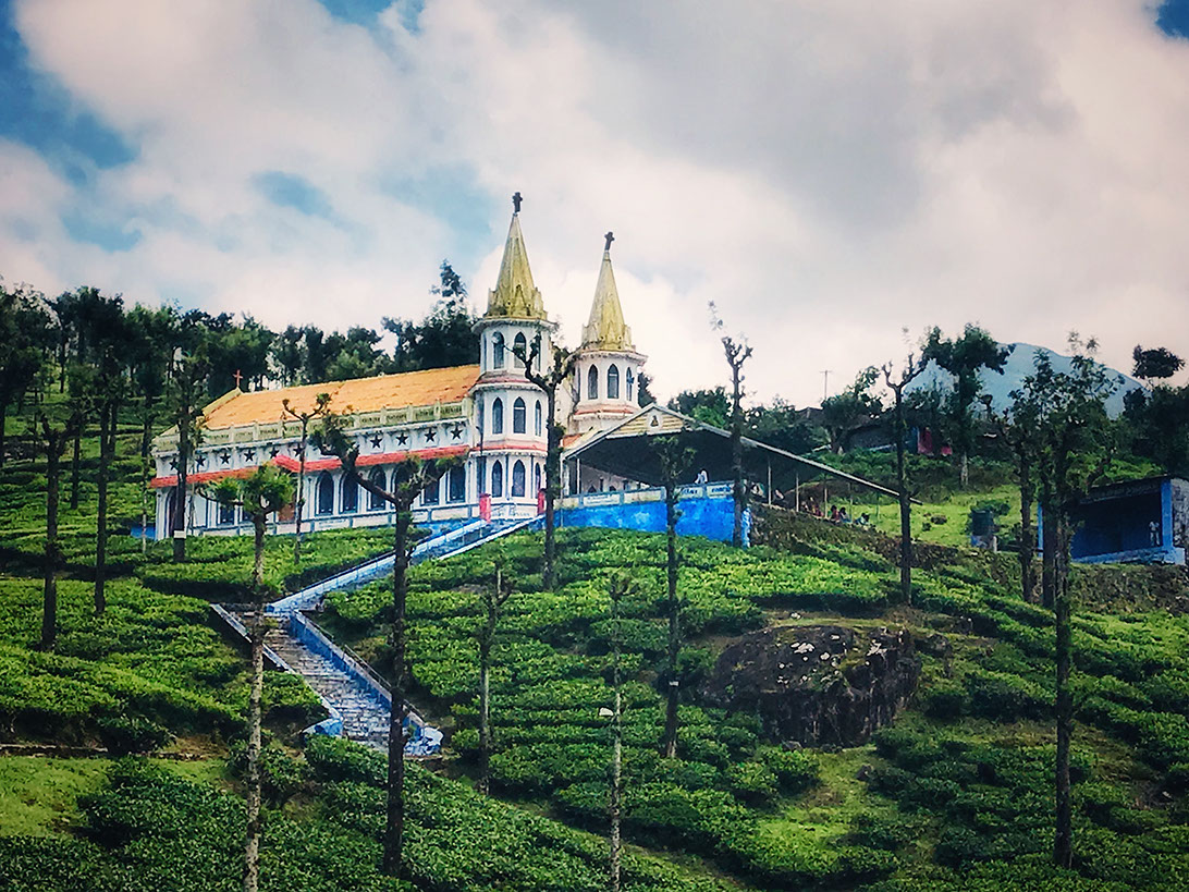 Karumalai Annai Velankanni Church amid tea gardens in Valparai