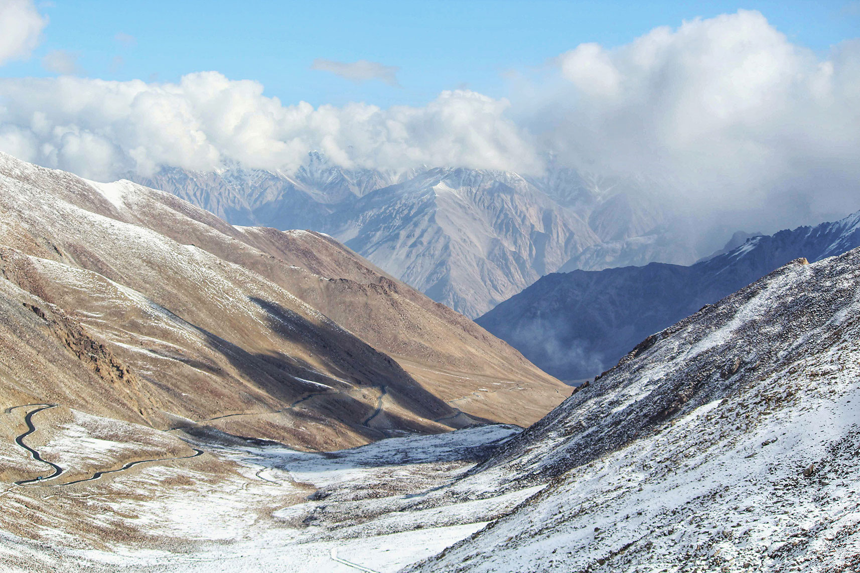 The Nubra Valley is surrounded by snow-capped mountains with Khardung La highway