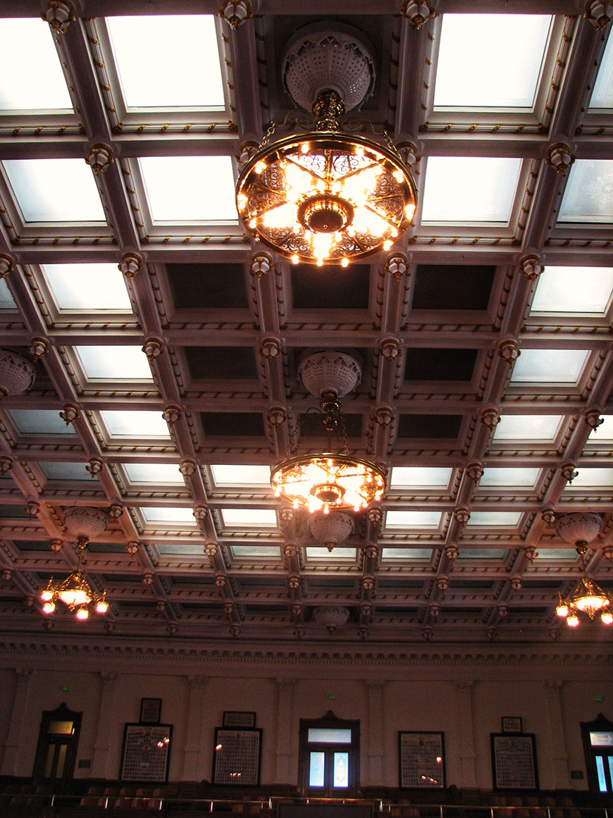 Beautifully designed brass chandeliers inside Texas Capitol