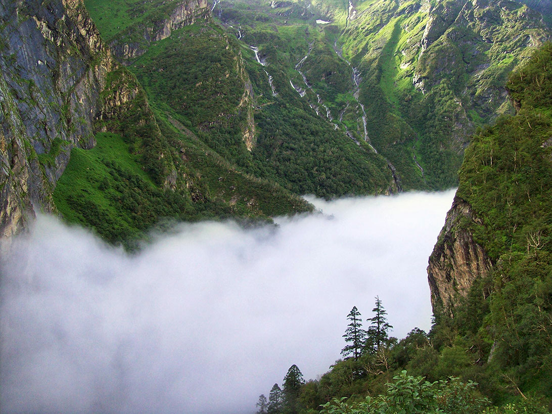 Mountains from above the clouds at Ghangaria on the way to Valley of Flowers
