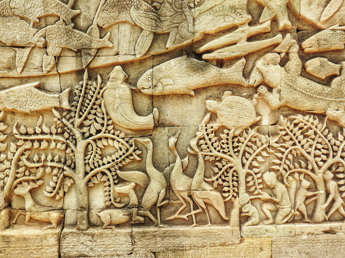 Intricate carvings in Angkor Wat depict the daily life of people during the Khmer Era