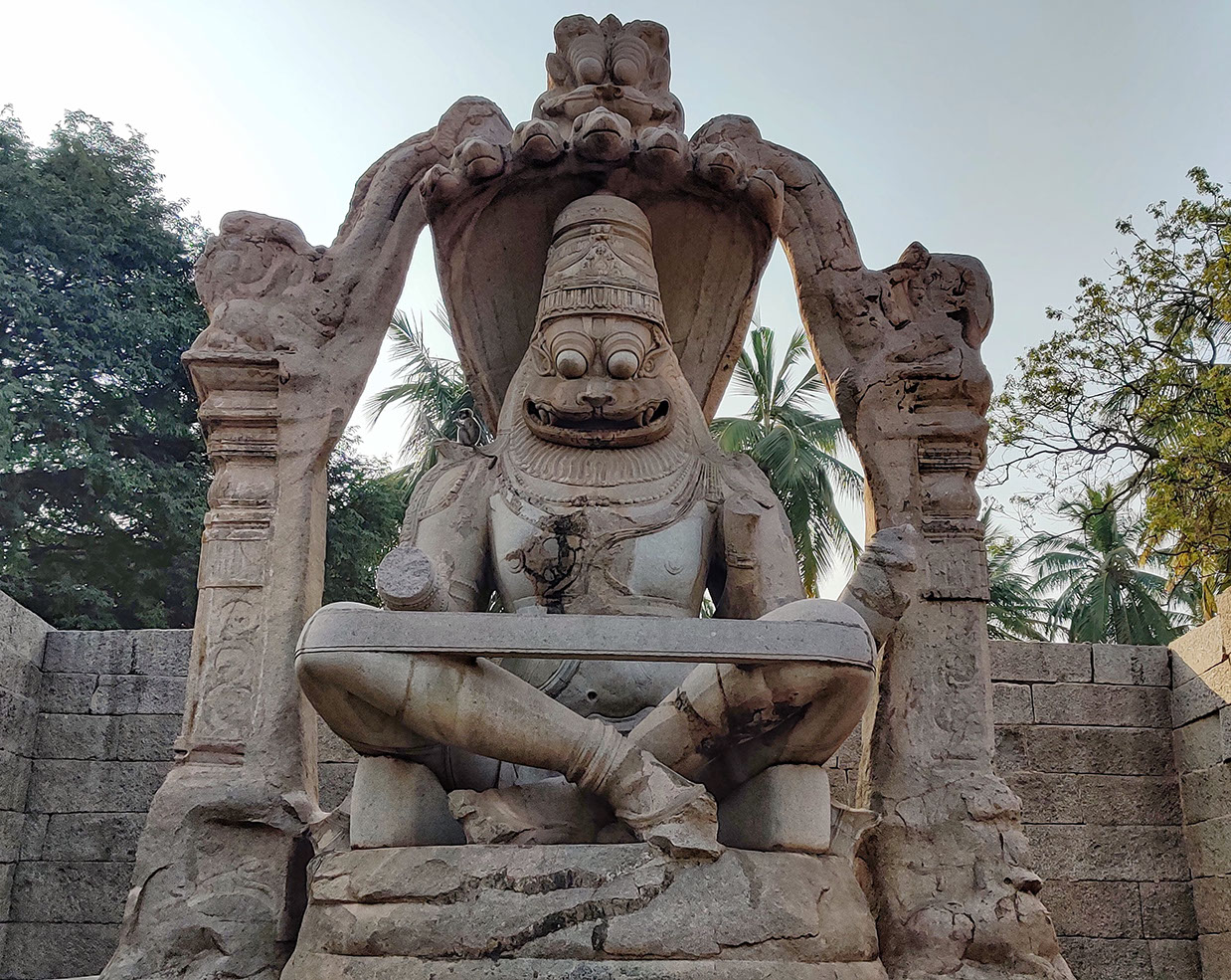 Striking statue of Laksmi Narasimha sitting in yoga posture